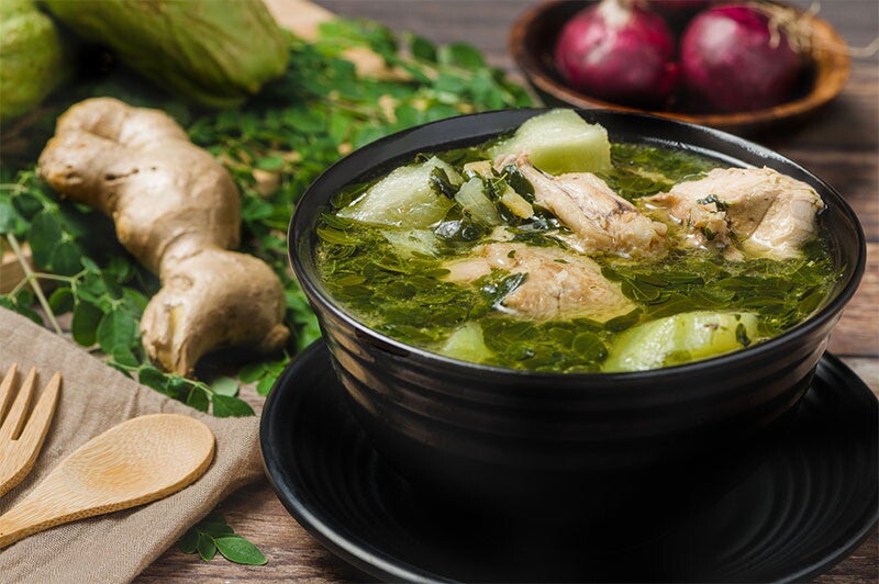 A bowl of chicken tinola with malunggay and green papaya