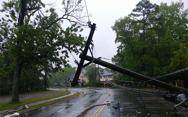 A downed powerline blocking the street.