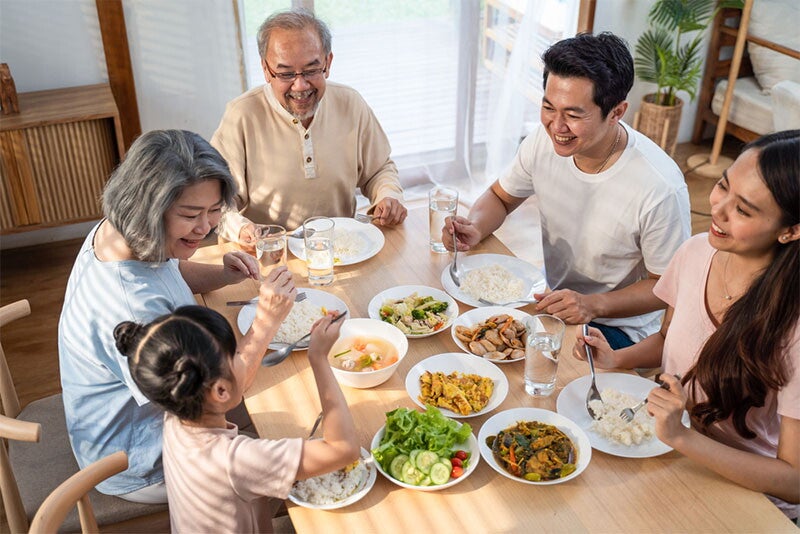 A multi-generational Asian family having lunch together