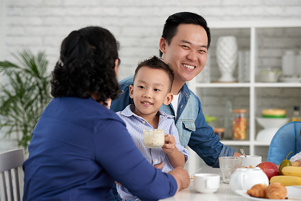 A kid politely speaking with an adult