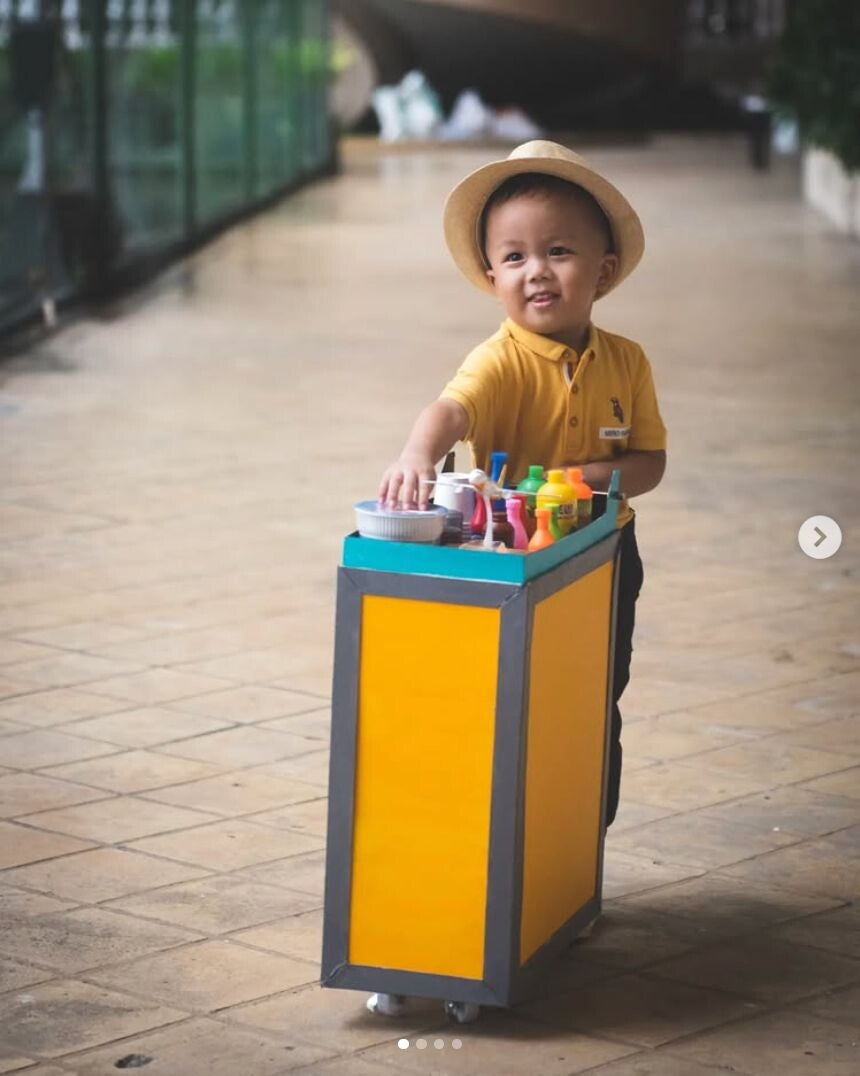 Asian boy in a Cebu Pacific uniform costume.