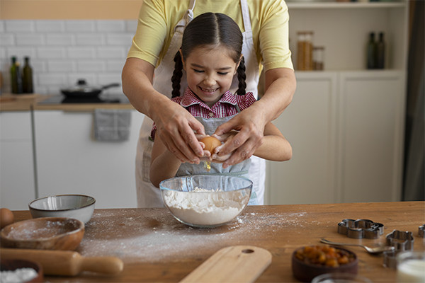 mom bonding with kid through cooking