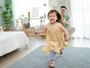 Asian dad gives his little girl an evacuation role as they practice their family emergency plan