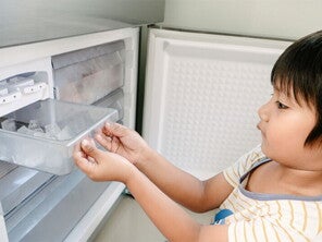 Young Asian boy looking for ice to eat, experiencing pica, one of the 5 weird signs of iron deficiency in kids. Young Asian boy looking for ice to eat, experiencing pica, one of the 5 weird signs of iron deficiency in kids.