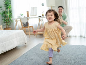 Asian dad gives his little girl an evacuation role as they practice their family emergency plan