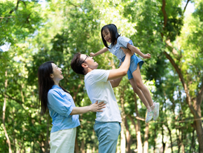 Young Asian parents models how to save money to their child by going to parks. Young Asian parents models how to save money to their child by going to parks.