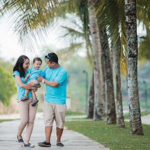 A young Asian couple with their child strolling at a park during one of the 2026 Philippine holidays. A young Asian couple with their child strolling at a park during one of the 2026 Philippine holidays.