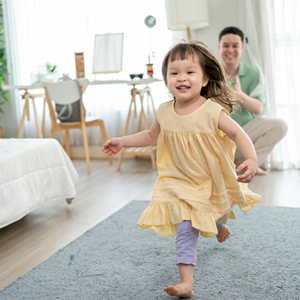 Asian dad gives his little girl an evacuation role as they practice their family emergency plan