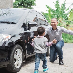 Asian toddler runs to his father, an OFW returning home for his annual leave Asian toddler runs to his father, an OFW returning home for his annual leave