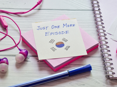 A Post-it note with the South Korean flag and the words "just one more episode A Post-it note with the South Korean flag and the words "just one more episode