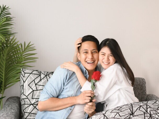 Young Asian couple enjoying date night at home.