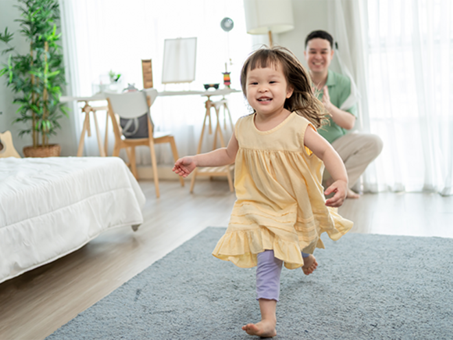Asian dad gives his little girl an evacuation role as they practice their family emergency plan