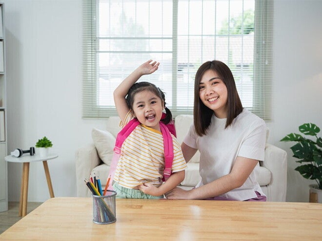 Asian mom and daughter excited to go to school