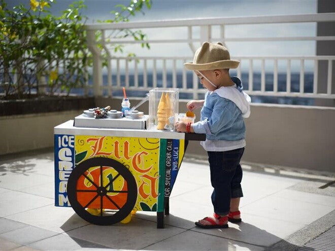Little boy dressed as an ice cream vendor for Buwan ng Wika.