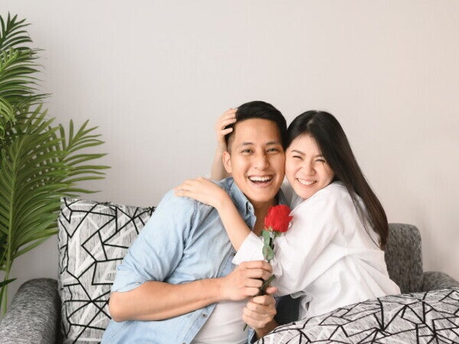 Young Asian couple enjoying date night at home.