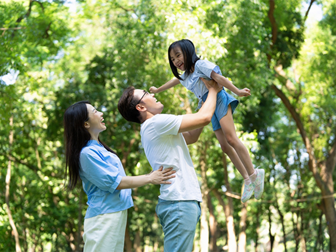 Young Asian parents models how to save money to their child by going to parks. Young Asian parents models how to save money to their child by going to parks.